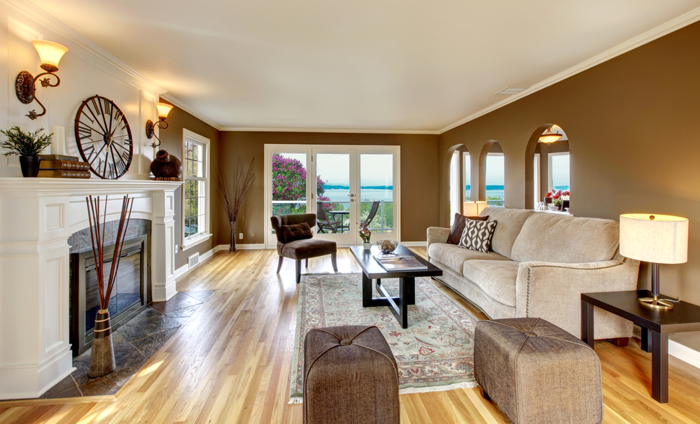 Beautiful living room with brown walls and fireplace.