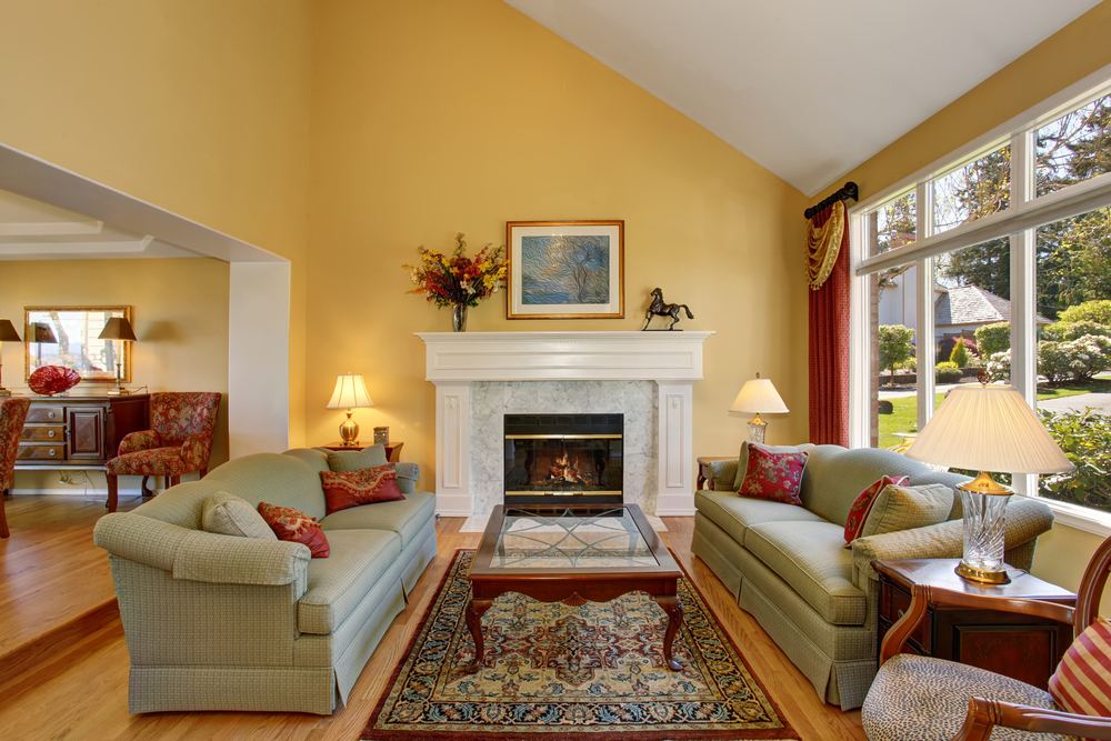 Brilliant interior of modern living room with yellow walls, and decor.